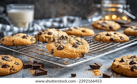 Freshly baked chocolate chip cookies on a rack to cool