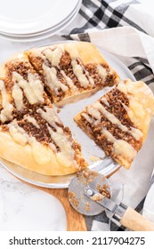 Freshly Baked Cinnamon Dessert Pizza With Cream Cheese Drizzle.