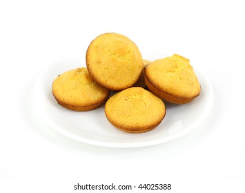 Freshly Baked Corn Muffins On White Plate