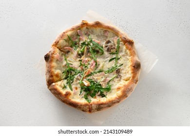 Freshly Baked Crispy Pizza With Bacon, Ham, Arugula And Cheese On White Background. Delivery Food. View From Above. Blonde Pizza.