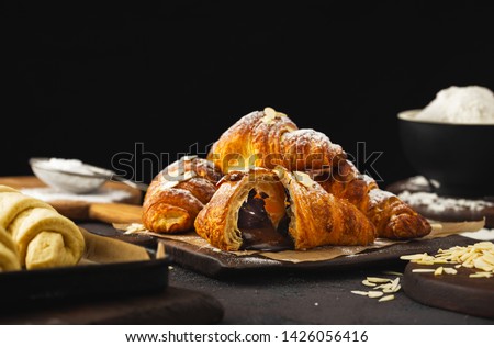 Freshly baked croissant with chocolate close up