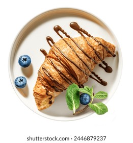 Freshly baked croissant with chocolate topping and blueberry on serving plate isolated on white background. Top view