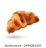 Freshly baked croissant flying in air, isolated on white background. Single French pastry croissant floating. Buttered bread croissant flying in air isolated on white.