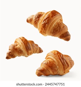 Freshly baked croissant flying in air, isolated on white background. French pastry croissants floating. Buttered bread croissants flying in air isolated. 