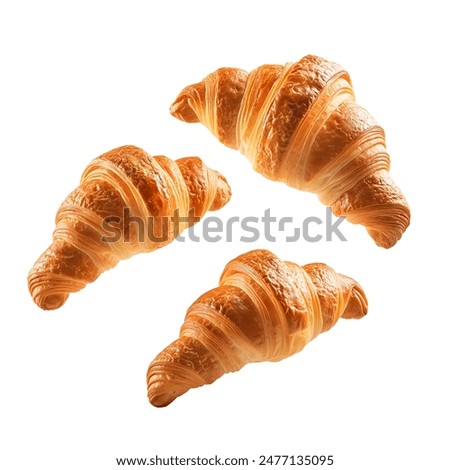 Freshly baked croissant flying in air, isolated on white background. French pastry croissants floating. Buttered bread croissants flying in air isolated.