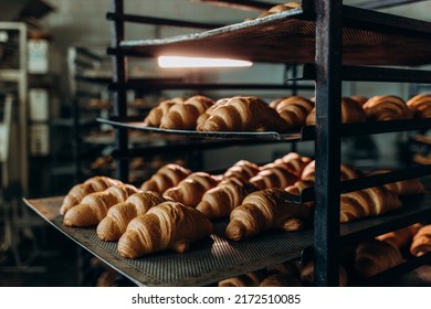 freshly baked croissants in the baking oven - Powered by Shutterstock