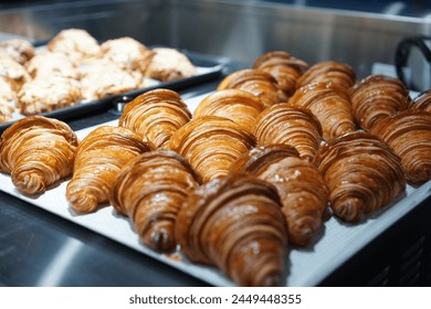 Freshly baked croissants on tray - Powered by Shutterstock