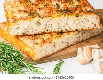 Freshly baked focaccia bread with rosemary and garlic. - Powered by Shutterstock