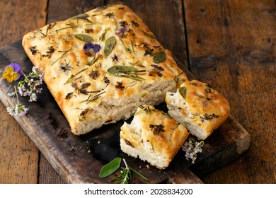 Freshly baked foccacia with herbs and flowers