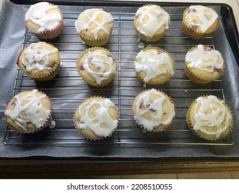 Freshly Baked And Frosted Lemon Raspberry Muffins