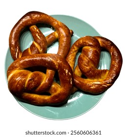 Freshly baked golden-brown homemade pretzels served on a stylish green plate. Perfect for food photography, baking themes, or culinary projects showcasing traditional baked goods. - Powered by Shutterstock