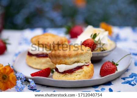 Freshly baked home made scones with strawbery jam and clotted cream