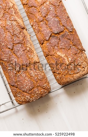 Similar – Foto Bild gebackenes Roggenbrot liegt Mehl auf einem Textiltuch.