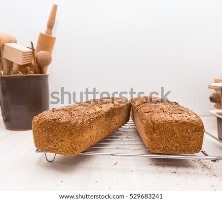 Similar – Foto Bild gebackenes Roggenbrot liegt Mehl auf einem Textiltuch.