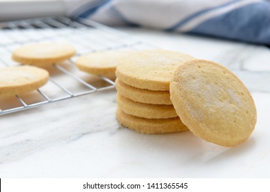 Freshly baked homemade butter shortbread biscuits dusted with sugar, selective focus