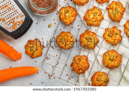 Freshly baked homemade carrot cookies with flax seed and pumpkin seeds close-up. Delicious and healthy vegetarian snack. Selective Focus