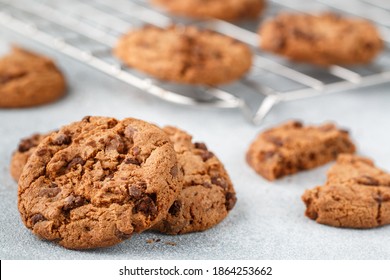 Freshly baked homemade crunchy cookies with chocolate chips, peanut butter or salted caramel. A delicious treat for gourmets. Biscuits close-up. Selective focus, shallow depth of field - Powered by Shutterstock