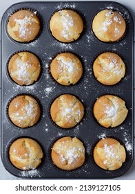 Freshly Baked, Homemade Cupcake In Muffin Tin With Paper Liner.