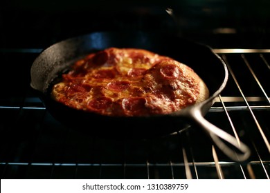 Freshly Baked Homemade Pepperoni Pizza In Cast Iron Pan From The Oven.