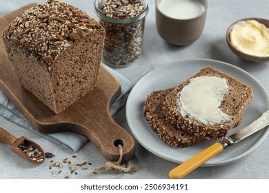 freshly baked homemade seeded multigrain sour dough bread with butter - Powered by Shutterstock