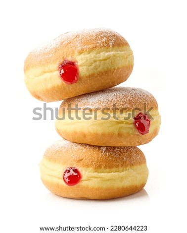 freshly baked jelly donuts stack isolated on white background