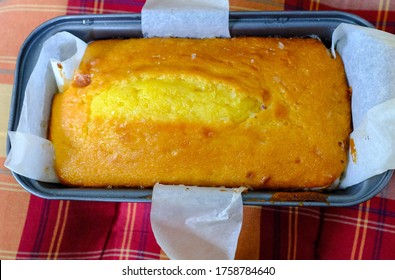 Freshly Baked Lemon Sponge Cake In Loaf Tin Lined With Greaseproof Paper. 