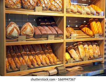 Freshly baked loaves of bread on a market stall - Powered by Shutterstock