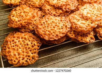 Freshly Baked Oatmeal Lace Cookies Resting On Oven Rack.