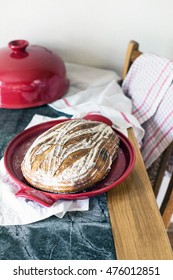 Freshly Baked Organic Sourdough Bread In A Red Dutch Oven