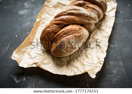 Similar – Image, Stock Photo rustic seeded bread, wrapped in striped fabric