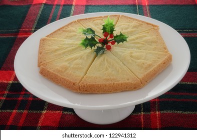 Freshly Baked Scottish Shortbread On White Cakestand With Tartan Background