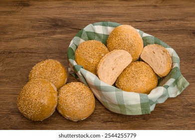 Freshly baked sesame buns on the table - Powered by Shutterstock