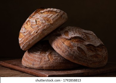 Freshly baked sourdough bread with floral decoration on it  - Shutterstock ID 1792858813