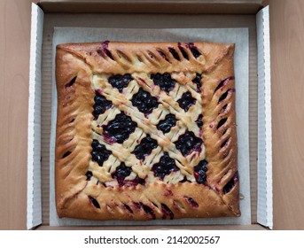 Freshly Baked Square Pie With Berries In A Cardboard Box For Delivery. Top View. Copy Space.