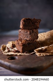 Freshly Baked Tasty Chocolate Brownies On A Wooden Background