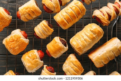 Freshly Baked Tasty Sausage Rolls On Cooling Rack, Top View