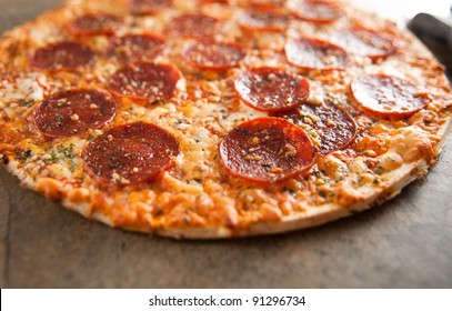 Freshly Baked Thin Crust Pepperoni And Cheese Pizza