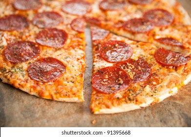 Freshly Baked Thin Crust Pepperoni And Cheese Pizza