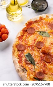 Freshly Baked Traditional Mediterranean Pizza With Tomato Sauce Marinara, Mozzarella Cheese, Pork Sausage Salsiccia And Basil