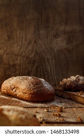 
Freshly baked wheat bread, homemade cakes, still life with bread, crisp loaf of bread, still life on a rustic background, top view, rustic bread, roll, loaf.