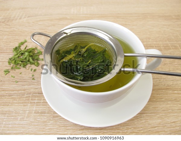 Freshly\
brewed tea from edible hemp in tea\
strainer