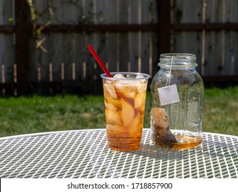 Freshly Brewing Sun Tea Or Sweet Tea In A Mason Jar In The Warm Sunshine Of Summertime.