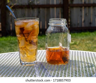 Freshly Brewing Sun Tea Or Sweet Tea In A Mason Jar In The Warm Sunshine Of Summertime.