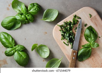 Freshly chopped basil leaves. Fresh basil on a wooden chopping board.  - Powered by Shutterstock