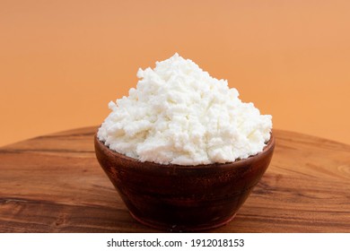 Freshly Churned White Butter Also Known As Safed Makhan Malai Or Homemade Makkhan In India Is Used To Prepare Desi Ghee In Wooden Bowl. Isolated On Beige Color Background With Copy Space For Text - Shutterstock ID 1912018153