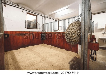 Freshly cleaned and empty stable at the ranch