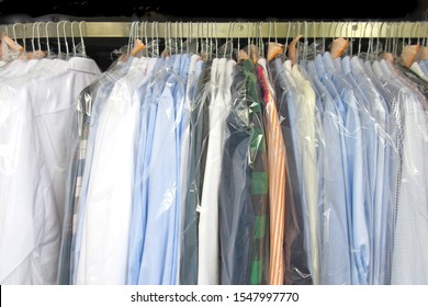 Freshly Cleaned Men's Shirts And Ladies Blouses
In A Dry Cleaning, Hung On Hangers And Protected By Plastic Film. Ready For Pick Up