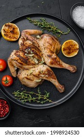 Freshly Cooked Rotisserie Chicken With Herbs, On Black Background, Top View