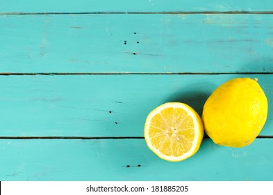 Freshly cut half and whole lemons on rustic boards. - Powered by Shutterstock