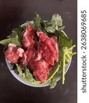 Freshly cut sacrificial meat prepared during the Muslim celebration of Eid al-Adha. This image represents the traditional Qurban ritual, where Muslims honor the spirit of giving and devotion by sharin